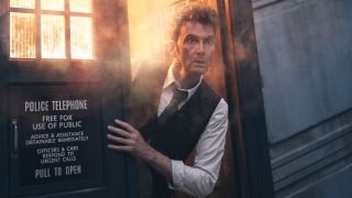 David Tennant's Doctor poking his head out of the TARDIS in a press image for the 60th Anniversary of Doctor Who.