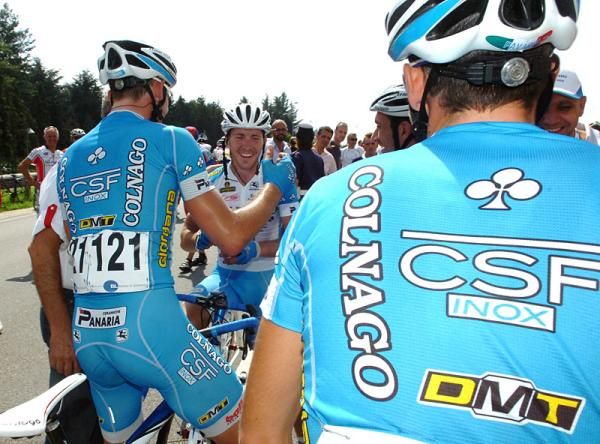Winner Manuel Belletti is congratulated by his Colnago - CSF Inox teammates.