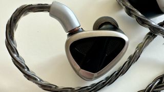 FiiO FH19 wired earbud on a white surface