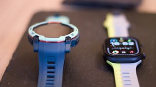 Garmin Instinct 3 next to the Apple Watch Ultra 2