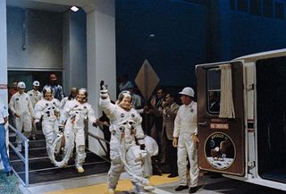 Apollo 11 astronauts Michael Collins, Buzz Aldrin and Neil Armstrong travel to the Saturn V rocket, ready to lift off and head for the moon. 