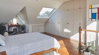 bedroom with storage and dormer window in loft conversion