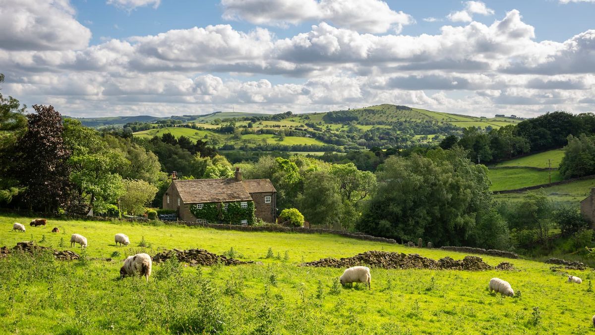 A house in a field next to the River Severn