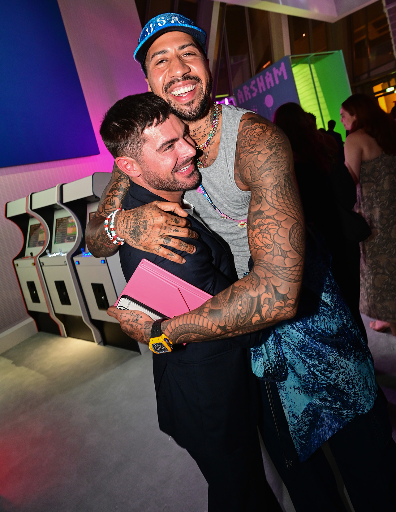 Zac Efron appears at Olympics 2024 party in Paris, France, hugging fencer.