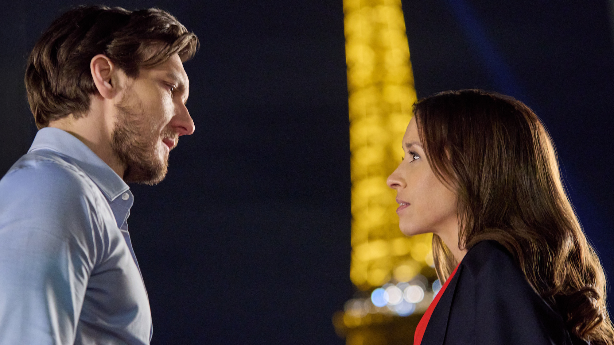 Lacey Chabert and Scott Michael Foster are shown at the Eiffel Tower in France while shooting Paris Is Always a Good Idea.