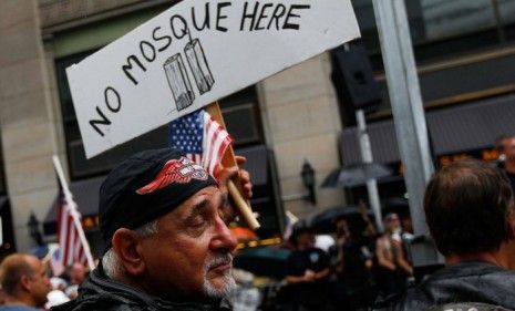 An opponent of the proposed mosque holds a sign during a demonstration on August 22, 2010.