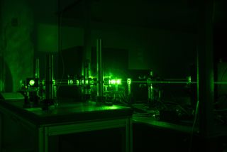 The Italian team used this instrument, called an interferometer, to split and recombine light. Here it's seen with an alignment laser beam.