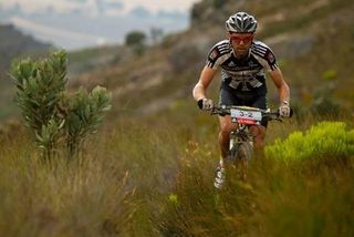 David George wears the zebra striped Outcast Jersey of a lone pro rider after his partner Kevin Evans broke his collarbone and dropped out.