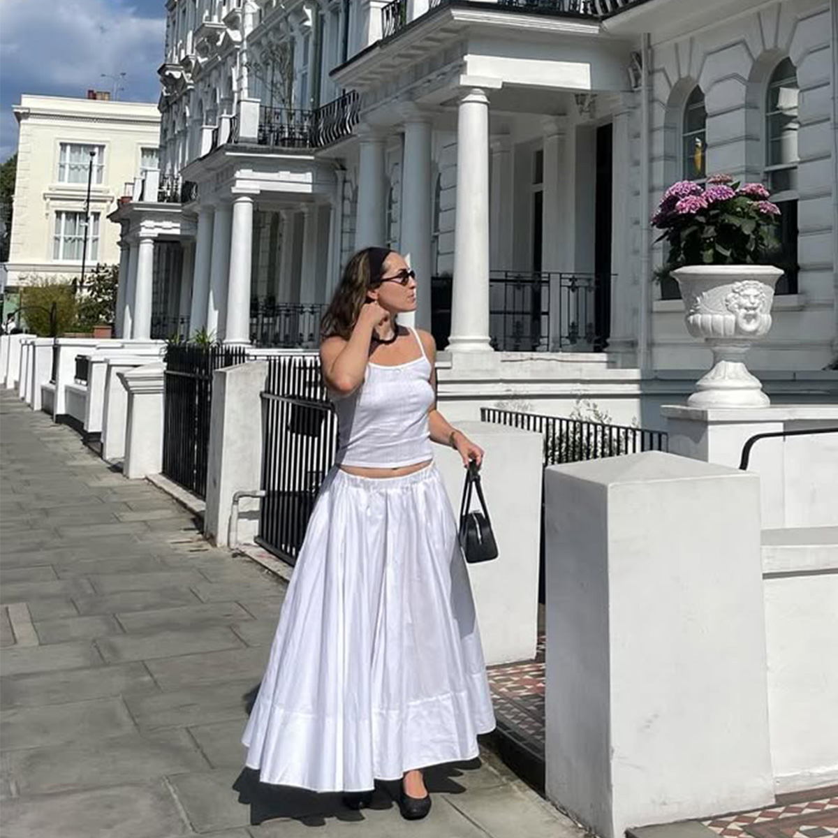 Anna Laplaca wearing an all white outfit. 
