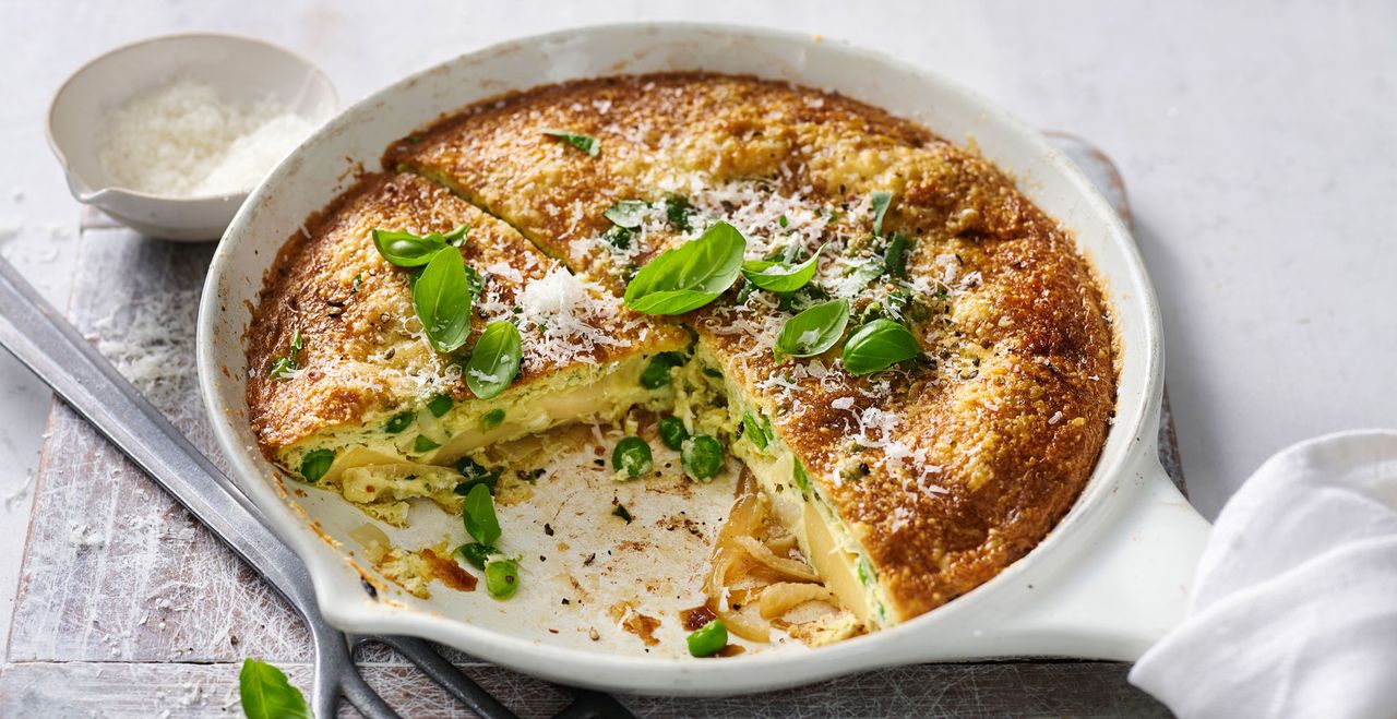 White cast iron skillet with a Frittata, used to illustrate an article on how to season a cast iron skillet