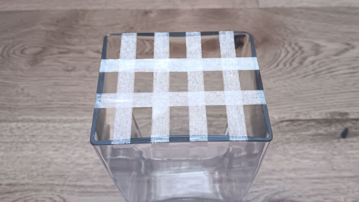 Glass flower vase with sticky tape to support an arrangement