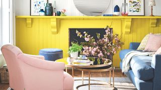 picture of living room with yellow, pink and blue furnishings