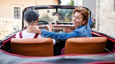 An older couple looking back.