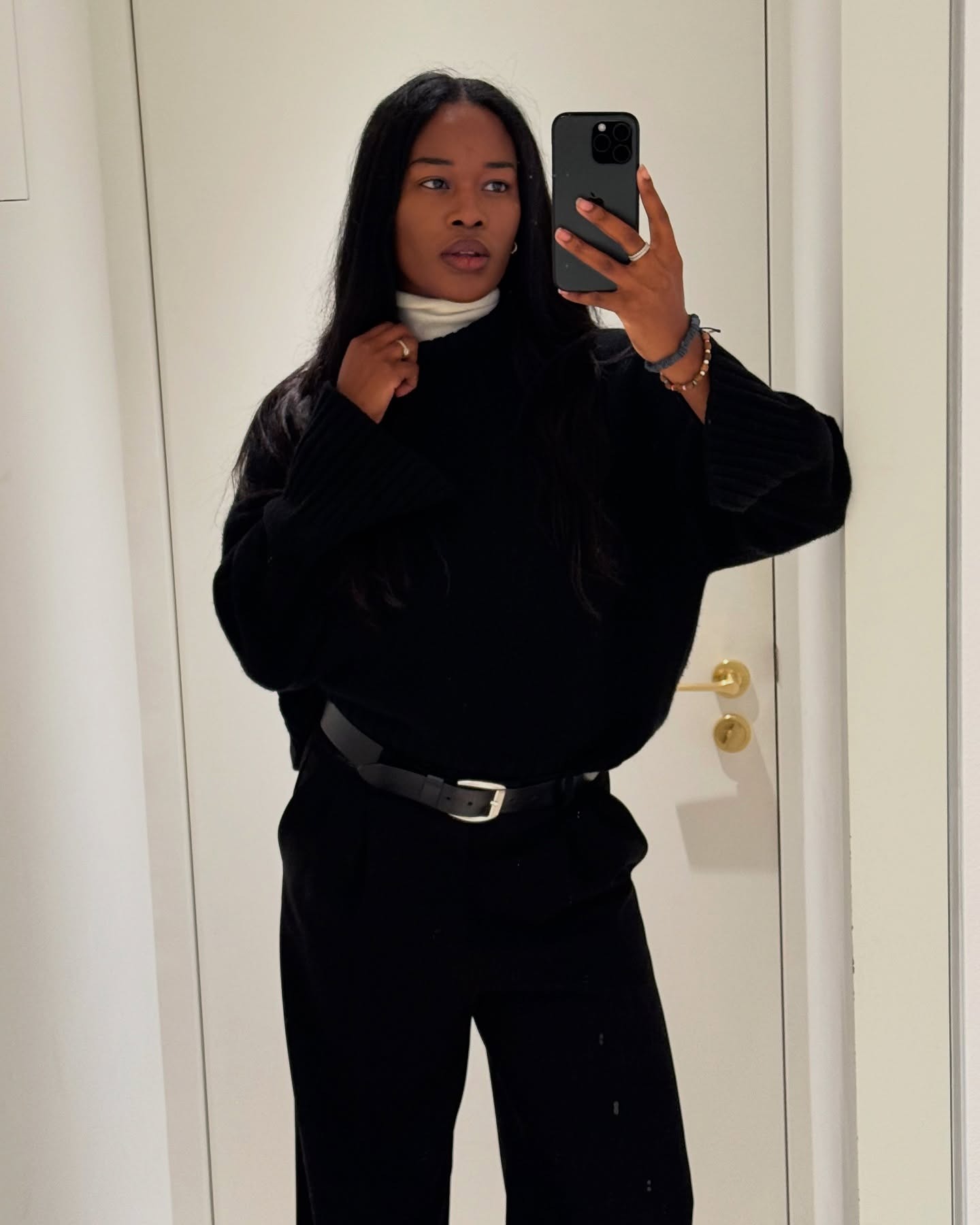 @nlmarilyn wearing a turtleneck sweater underneath a crewneck sweater.