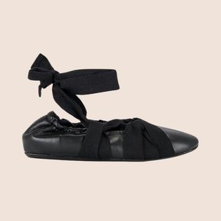 Flat lay image of black ballet flats