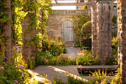 The pergola garden was Henry Avray Tipping&rsquo;s tribute to William Robinson. Mounton House, Chepstow, Monmouthshire. &copy;John Campbell