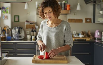 Woman preparing meals for a 4 week weight loss plan