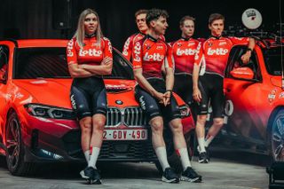 Five riders pose in their 2025 Lotto kit