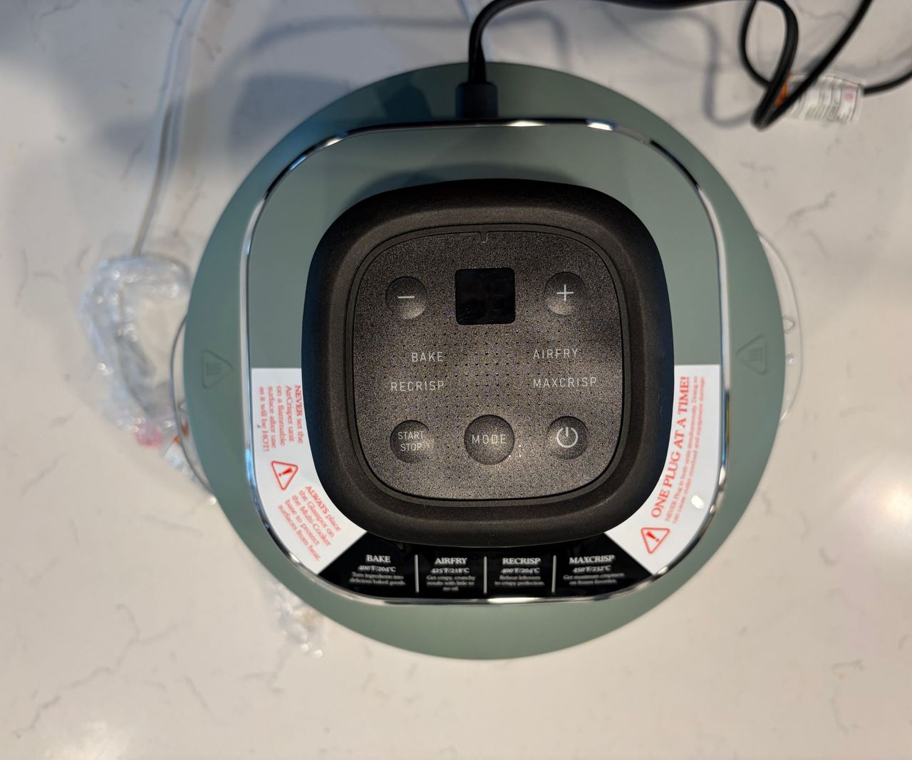 The top of an air fryer control panel viewed from above.