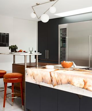 Glowing countertops in navy and white kitchen