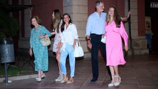 Queen Sofia, Princess Sofia of Spain, Queen Letizia of Spain, King Felipe VI of Spain and Crown Princess Leonor of Spain pose for the photographers after watching the movie Barbie at the Cineciutat cinema