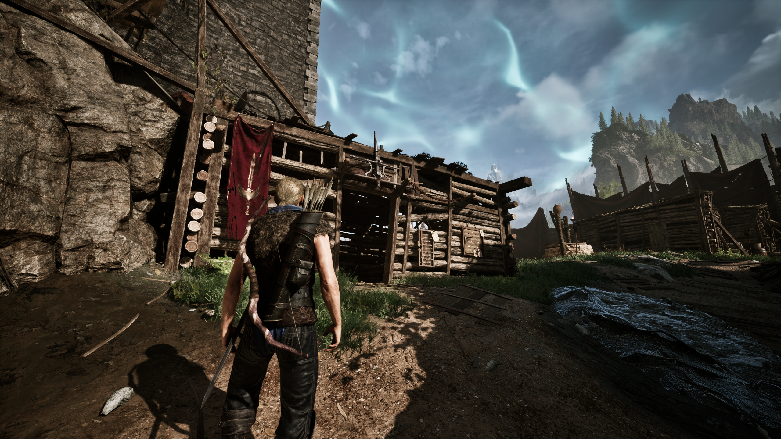 Gothic Remake Scatty's chest: A player stood outside Scatty's hut near the castle walls in the Old Camp, during the day, facing the building.