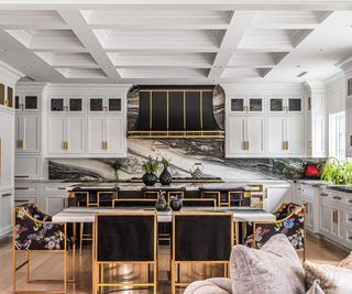 A black, white, and gold kitchen with striking kitchenware deigns