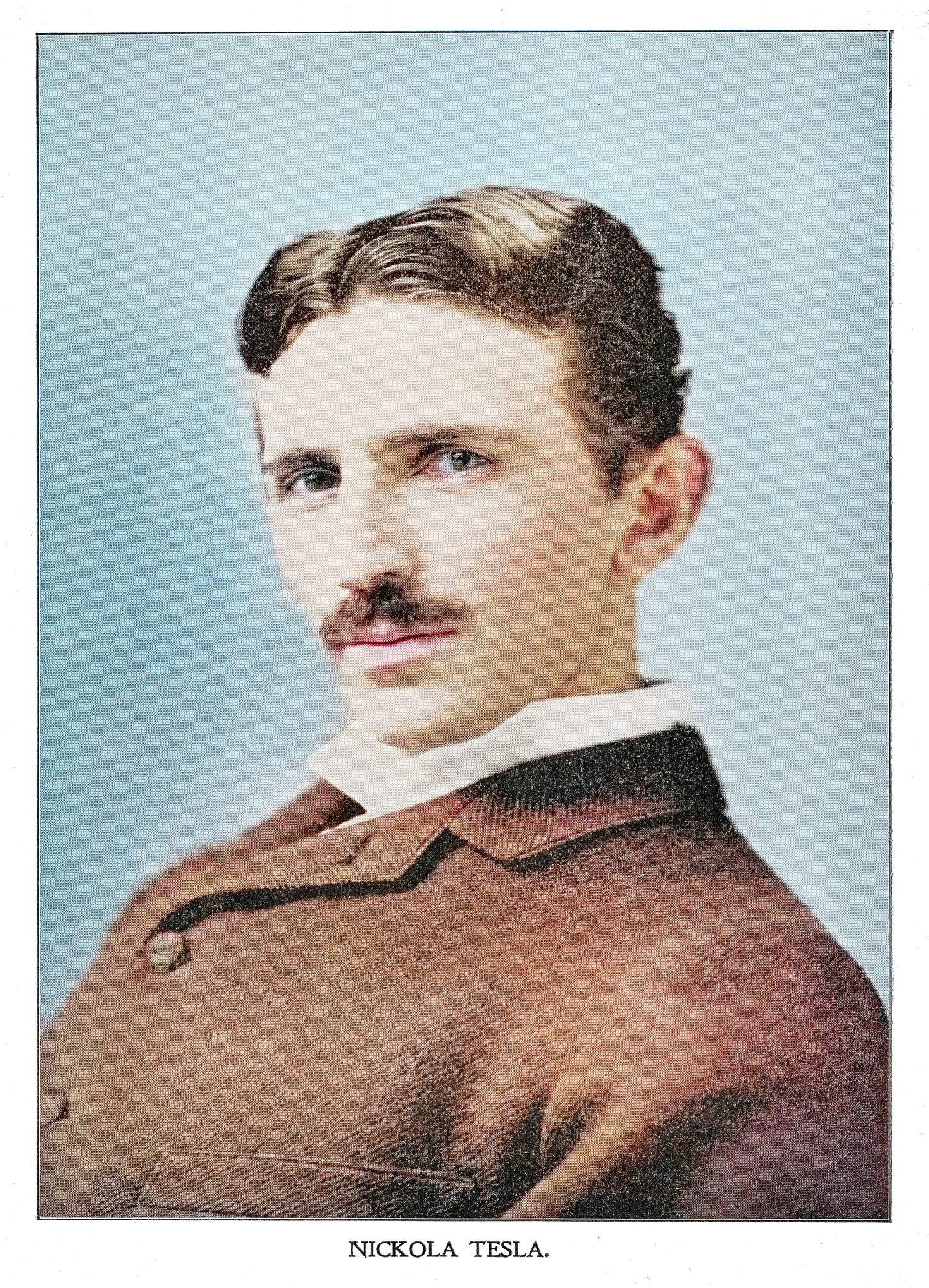 colorized portrait of Nikola Tesla shows a man from the chest up wearing a brown jacket and a white collar shirt. he has brown hair and a moustache.