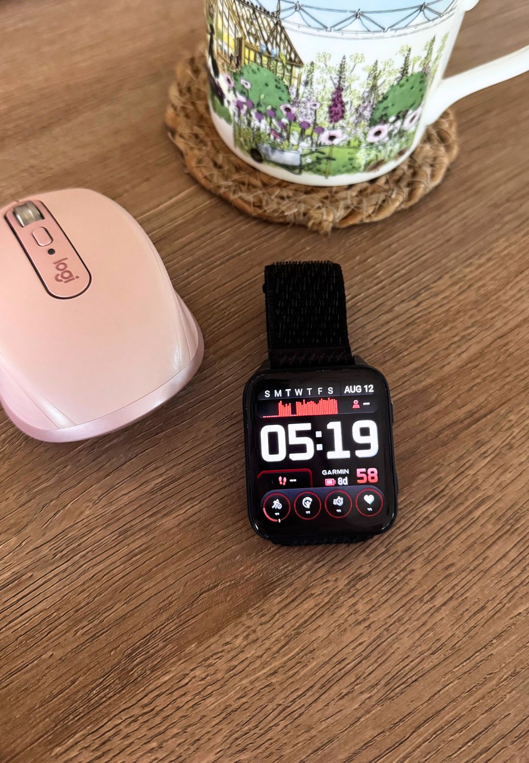 A close up of the Garmin Venu X1 fitness tracker and smart watch on Health Writer Anna Bartter&#039;s desk while she was testing for this review article
