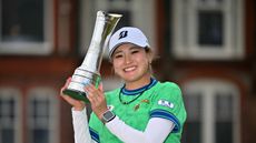 Shiho Kuwaki poses with the AIG Women's Open trophy following her win in 2026