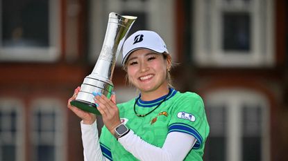 Shiho Kuwaki poses with the AIG Women's Open trophy following her win in 2026