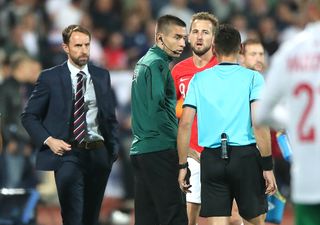 Gareth Southgate and Harry Kane speak to Croatian referee Ivan Bebek during the Euro 2020 qualifier in Sofia