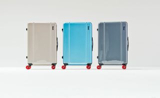 The alternative innovator Cabin, by Floyd. Three hard shell carry-on cases on wheels in light pink, blue and grey.