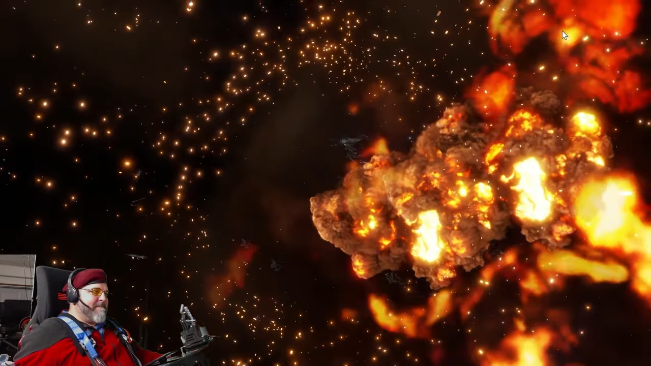 A green-screened picture-in-picture stream of CMDR Wacko piloting the SimStarr rig to play Elite Dangerous.