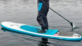 Man paddleboarding in Gill Marine Edge Boots