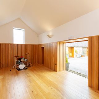 house barn with wooden floor and drum set