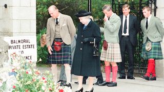 Royal Family, Balmoral Estate, Scotland, 5th September 1997. After attending a private service at Crathie Church, Royal family stop to look at floral tributes left for Princess Diana, at the gates of Balmoral Castle. They are: Queen Elizabeth II, Prince Philip, Prince Charles, Peter Phillips.