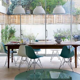 dining area with dining table and chairs and glass door