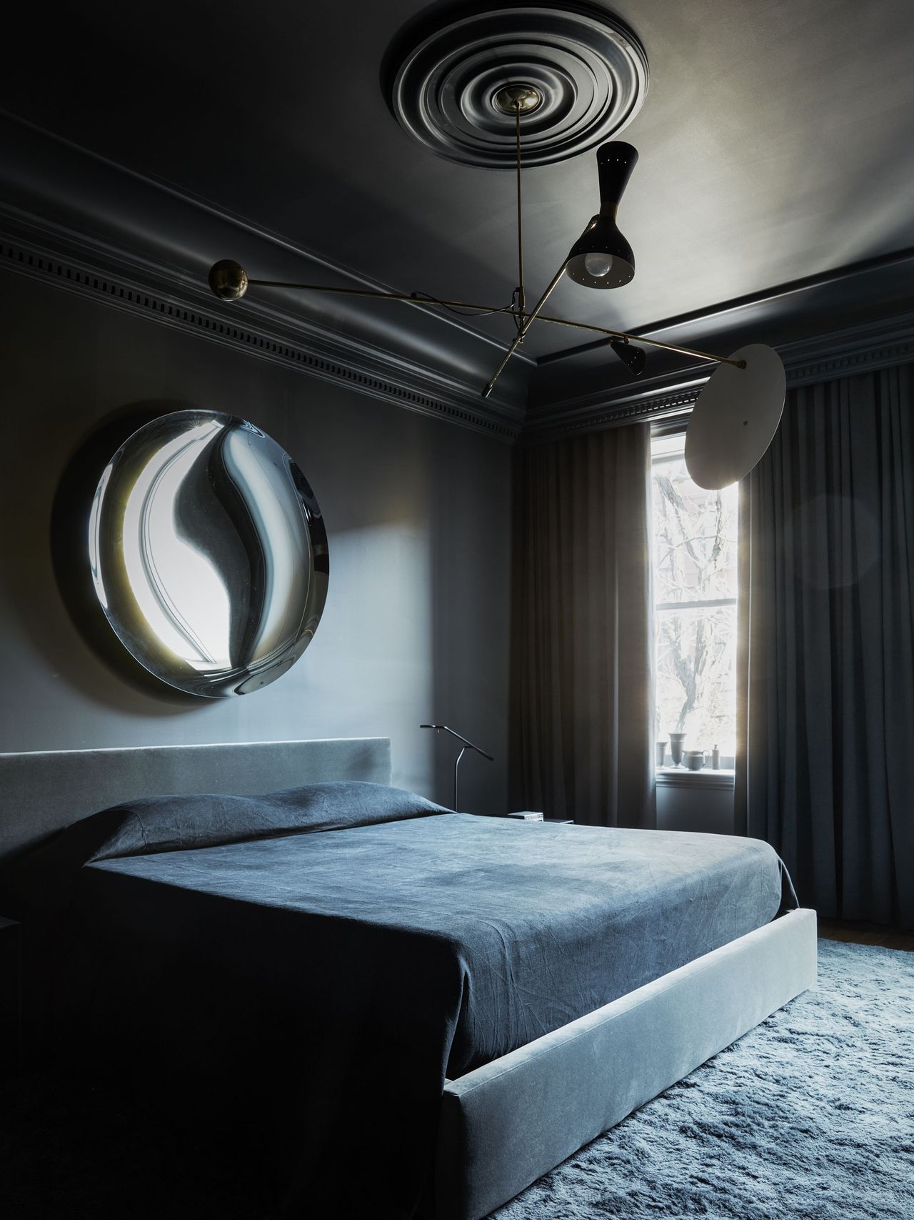 a dark gray monochromatic bedroom