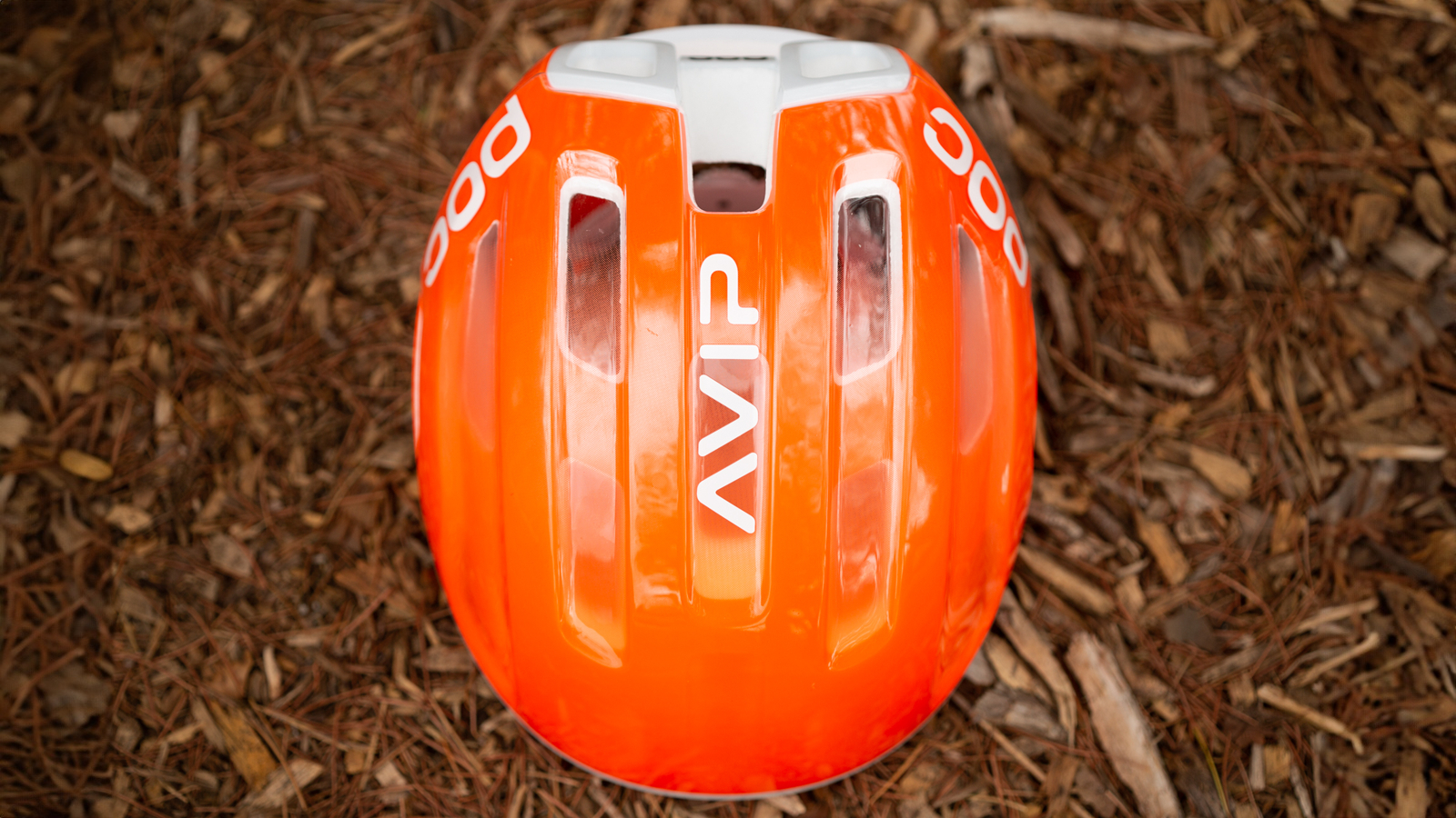 A above view of an orange and white helmet