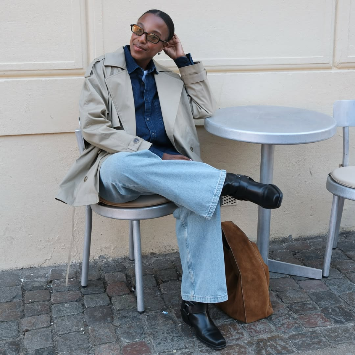 @taffymsipa wears jeans, black boots, trench coat