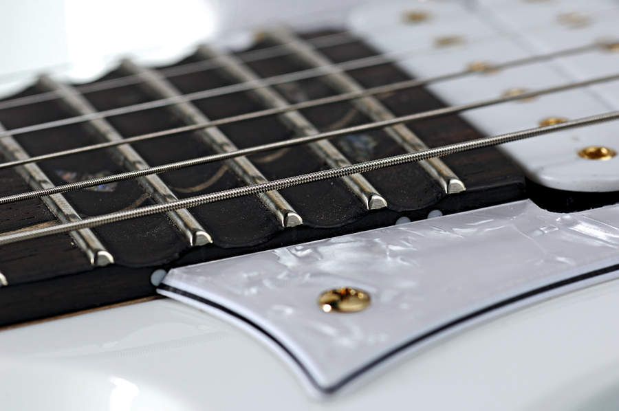 The top frets are scalloped for easy shredding