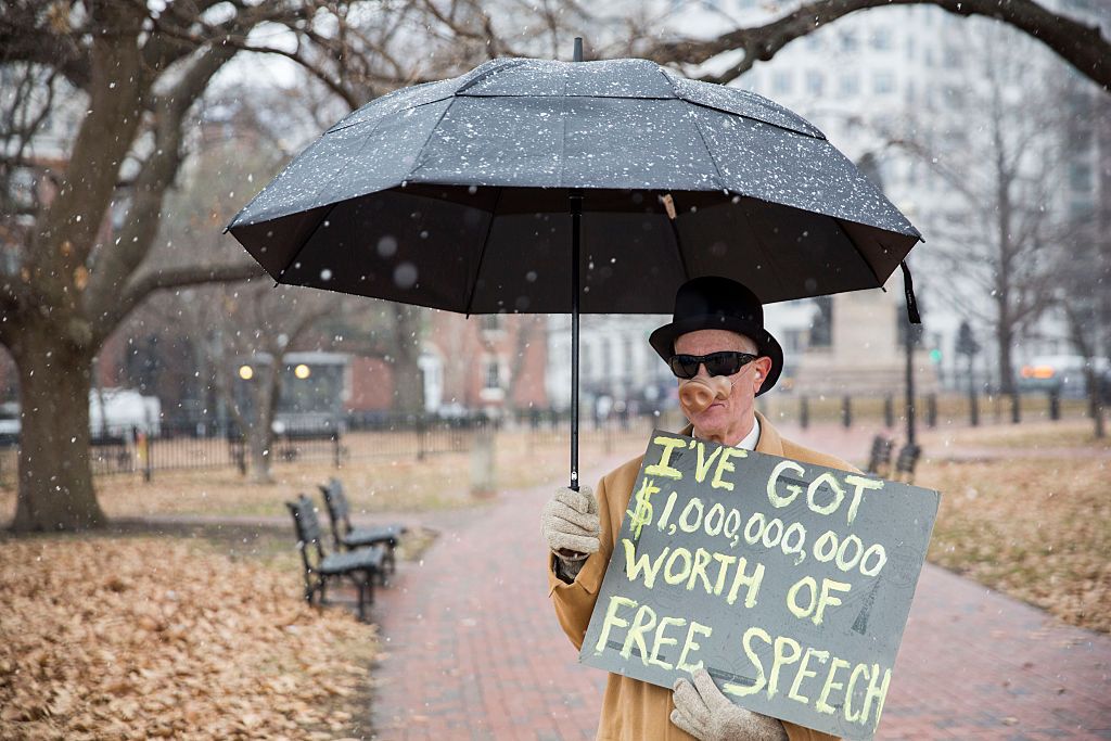 Man protests lax campaign finance laws