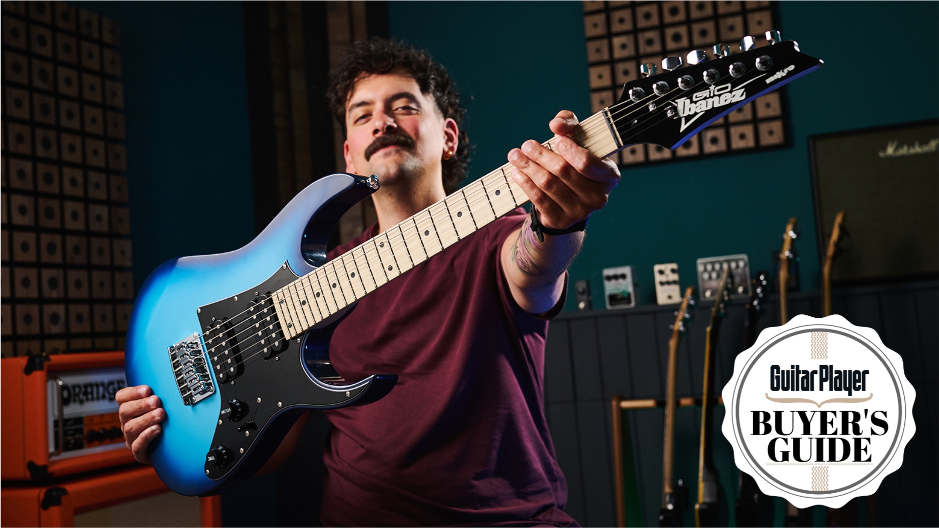 Guitar Player writer Matt McCracken holds an Ibanez beginner electric guitar up to the camera