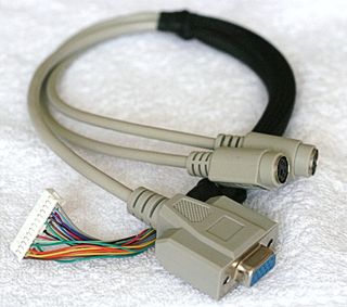 The Kalapatis cable hooks up to the 26-pin block on one end, with ports for VGA, mouse, and keyboard (both PS/2) on the other.