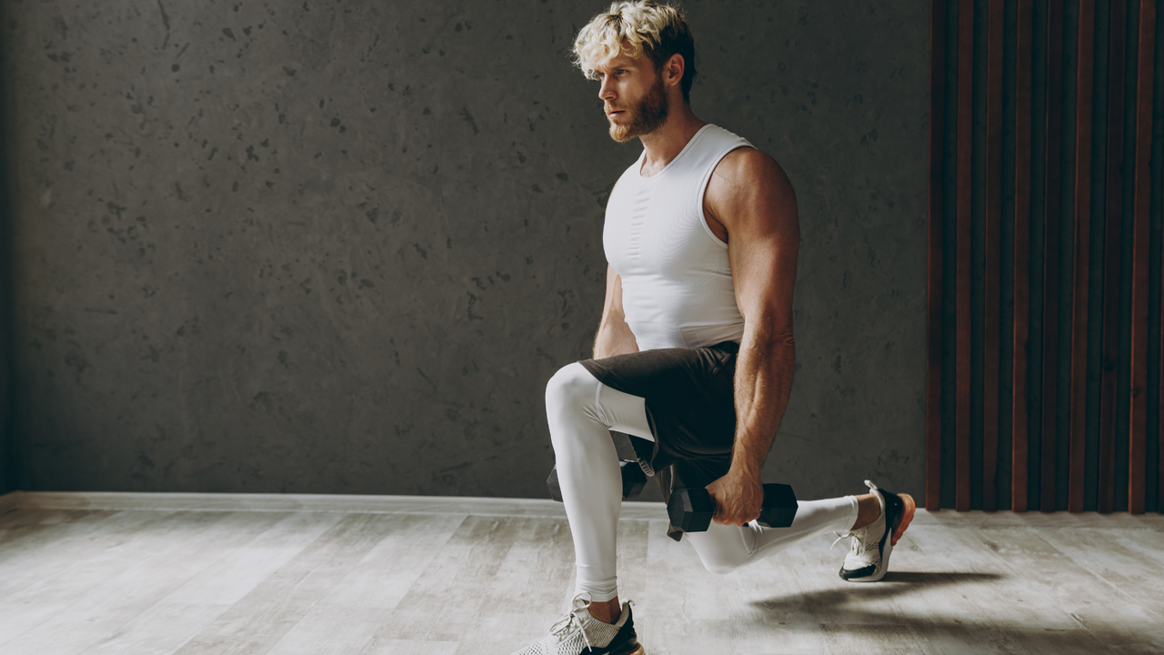 Glute workout: Man doing dumbbell lunges