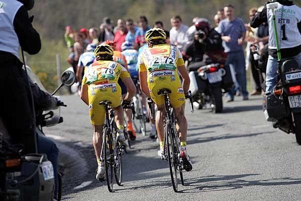 Ruben Lobato (l) and Angel Gomez Marchante ride together during stage 2