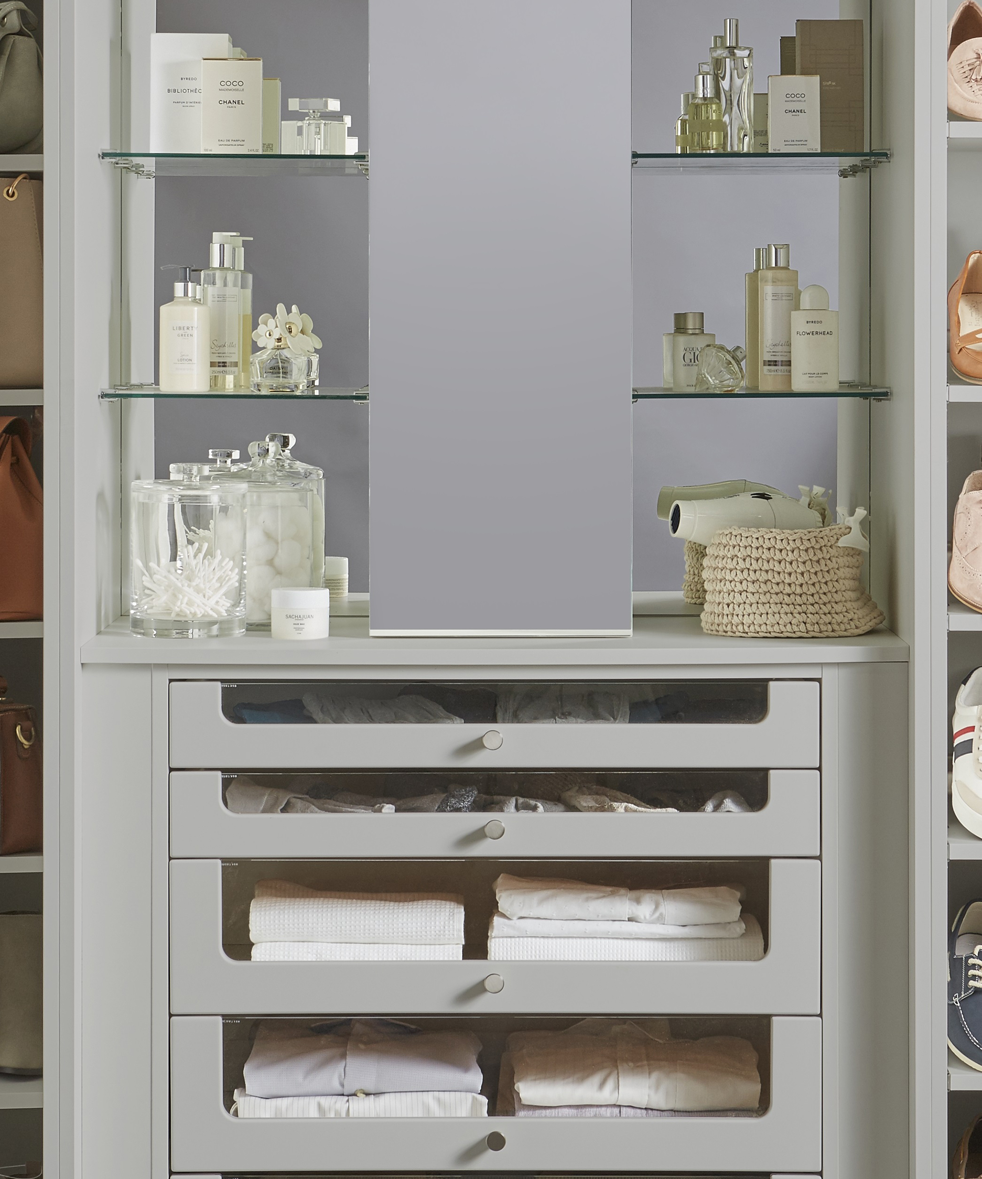 A built-in 'beauty bay' with cosmetics and towel storage