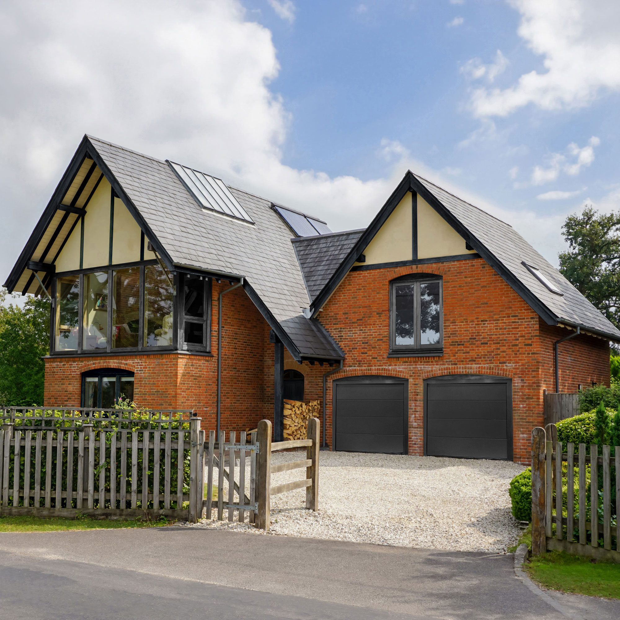 modern house with twin garages and gravel driveway