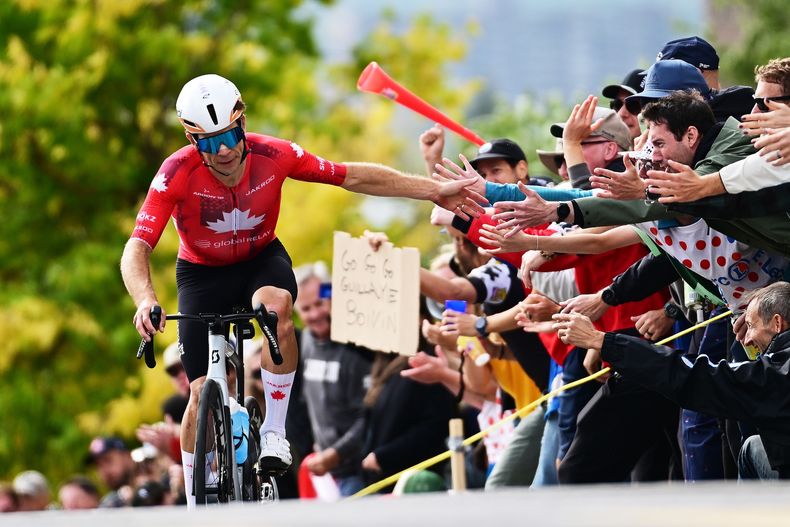 Guillaume Boivin (Canada) high-fives fans at the end of his 140km break in the elite men's road race at the UCI Road World Championships.
